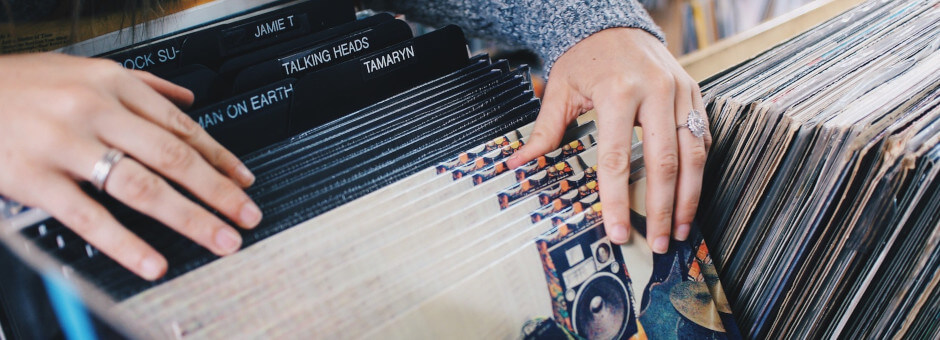 Searching through a selection of vinyl records