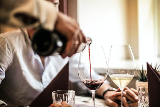 Wine being poured into glass