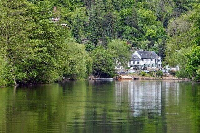 Views of a lake and house at Symonds Yat