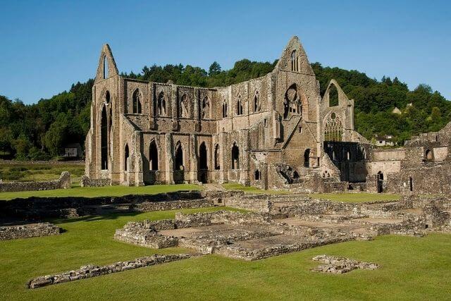 the ruins of Tintern Abbey with blue skies