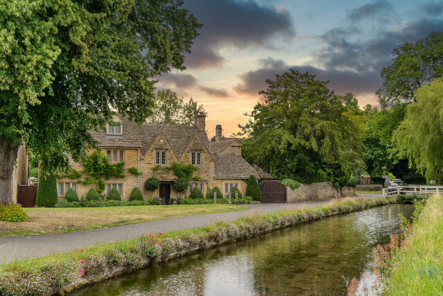 River walk with honey coloured cottages 