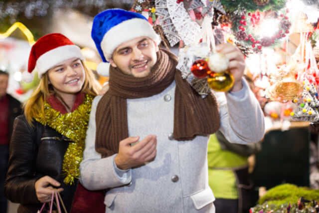 ouple looking at gifts at Christmas Market